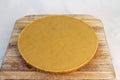 Cake of beeswax isolated on a wooden board