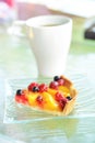 Cake with berries on the glass plate Royalty Free Stock Photo