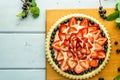 Cake with berries Pie with strawberries on blue rustic table