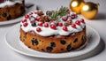 A cake with berries and a sprig of pine on top Royalty Free Stock Photo