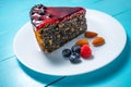 Cake with berry fruits, chia cereals and nuts isolated on wooden background Royalty Free Stock Photo