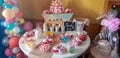 Cake, candies, marshmallows, cakepops, fruits and other sweets on dessert table at kids birthday party Royalty Free Stock Photo