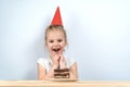 Cake candles birthday. the child holds the cake