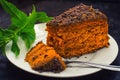 Cake with chocolate, honey and mint. Black background. Top view. Close-up