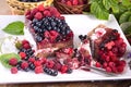 Cake with cream and fresh raspberries and blueberries delicious healthy dessert Royalty Free Stock Photo
