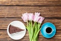 Cake and cup of coffee with tulips Royalty Free Stock Photo