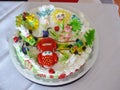 the cake is decorated with beautiful figures on the table in a plate