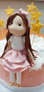 Cake decorated with a doll made of sugarpaste. Pastry Royalty Free Stock Photo