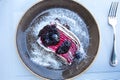 Cake dessert with berries cream at plate and blueberries