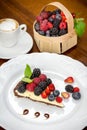 Cake dessert with coffee and forest fruits