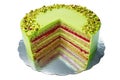 Cake with fruity cream and pistachio decorated with nuts, isolated