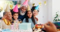 Cake, happy and family at birthday party celebration together at modern house with candles. Smile, excited and young Royalty Free Stock Photo