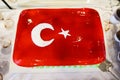 Cake with icing painted Turkish flag, restaurant food concept in the hotel Royalty Free Stock Photo