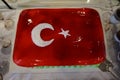 Cake with icing painted Turkish flag, restaurant food concept in the hotel Royalty Free Stock Photo