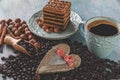 Cake layers black coffee in a cup and beans Royalty Free Stock Photo