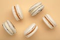 Cake macaron or macaroon on beige background. Space for text