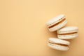 Cake macaron or macaroon on beige background. Space for text