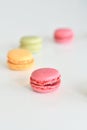 Cake macaron or macaroon on white background, sweet and colorful almond cookies with various pastel colors, vintage look.