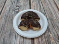 Donut cake sprinkled with chocolate messes