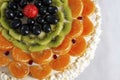 Cake made from natural ingredients, fresh kiwi, grapes, tangerine and strawberry, closeup Royalty Free Stock Photo