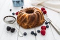 Cake. Marble cake cup of coffee powder sugar kitchen vintage utensil and fresh fruit berries Royalty Free Stock Photo