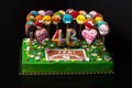 Cake with mastic on prom night on black background. The names of