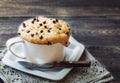 Cake in mug with peanut butter and chocolate chips Royalty Free Stock Photo