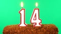 Cake with the number 14 lighted candle. Chroma key. Green Screen. Isolated