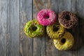 Cake pink green yellow set delivery chocolate wood round Royalty Free Stock Photo