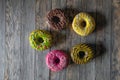 Cake pink green yellow set delivery chocolate wood round Royalty Free Stock Photo