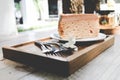 Cake on plate with fork and flower on wood table vintage tone. Royalty Free Stock Photo