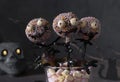 Cake pops as spooky monsters of dark chocolate for kids on Halloween party Royalty Free Stock Photo