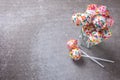 Cake pops can on grey slate background. Royalty Free Stock Photo