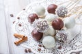 Cake pops decorated with white, dark chocolate and coconut on napkin, natural light Royalty Free Stock Photo