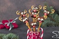 Cake pops Santa reindeers from marshmallows, sweet straw and chocolate on brown background, Idea Christmas treats for Royalty Free Stock Photo