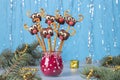 Cake pops Santa reindeers from marshmallows, sweet straw and chocolate on blue background, Idea Christmas treats for Royalty Free Stock Photo