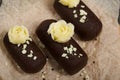 Cake potato. Decorated with butter cream. Against the background of black pine boards. Shot close-up Royalty Free Stock Photo