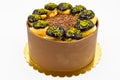 Cake with profiterol and chocolate pistachio