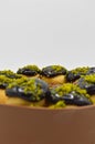 Cake with profiterol and chocolate pistachio Royalty Free Stock Photo