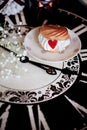 Cake profiteroles with cream and marmalade heart