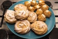 Cake profiteroles and Shu on a platter