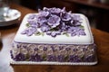 a cake with purple flowers on it