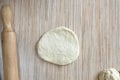 A cake of raw dough lies on the surface of the table for further preparation Royalty Free Stock Photo