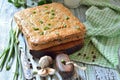 Cake with red rice and meat on the table