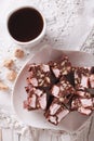 Cake Rocky road and coffee on a table close-up. vertical view fr Royalty Free Stock Photo