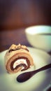 Cake roll with cup of coffee Royalty Free Stock Photo