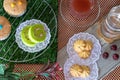 Cake Roll, Cupcake, Cookie, Strawberry Tea, Water on Table