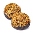 Cake rum truffle two balls with chopped nuts isolated on the white background Royalty Free Stock Photo