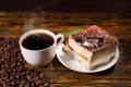 Cake slice in plate with coffee and beans Royalty Free Stock Photo