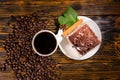 Cake slice in plate with coffee and beans Royalty Free Stock Photo